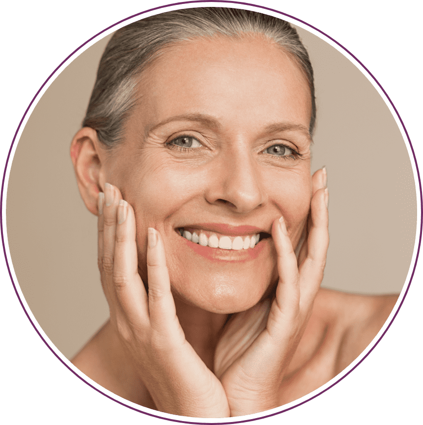 Smiling woman holding her face with both hands