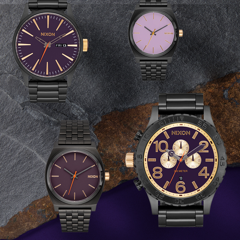 laydown image of all watches in the mixed metal collection laying on top of a slab of slate.