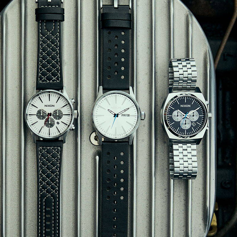 All three watches in the Chrome Collection laid flat on stainless steel in Thunderbird car.