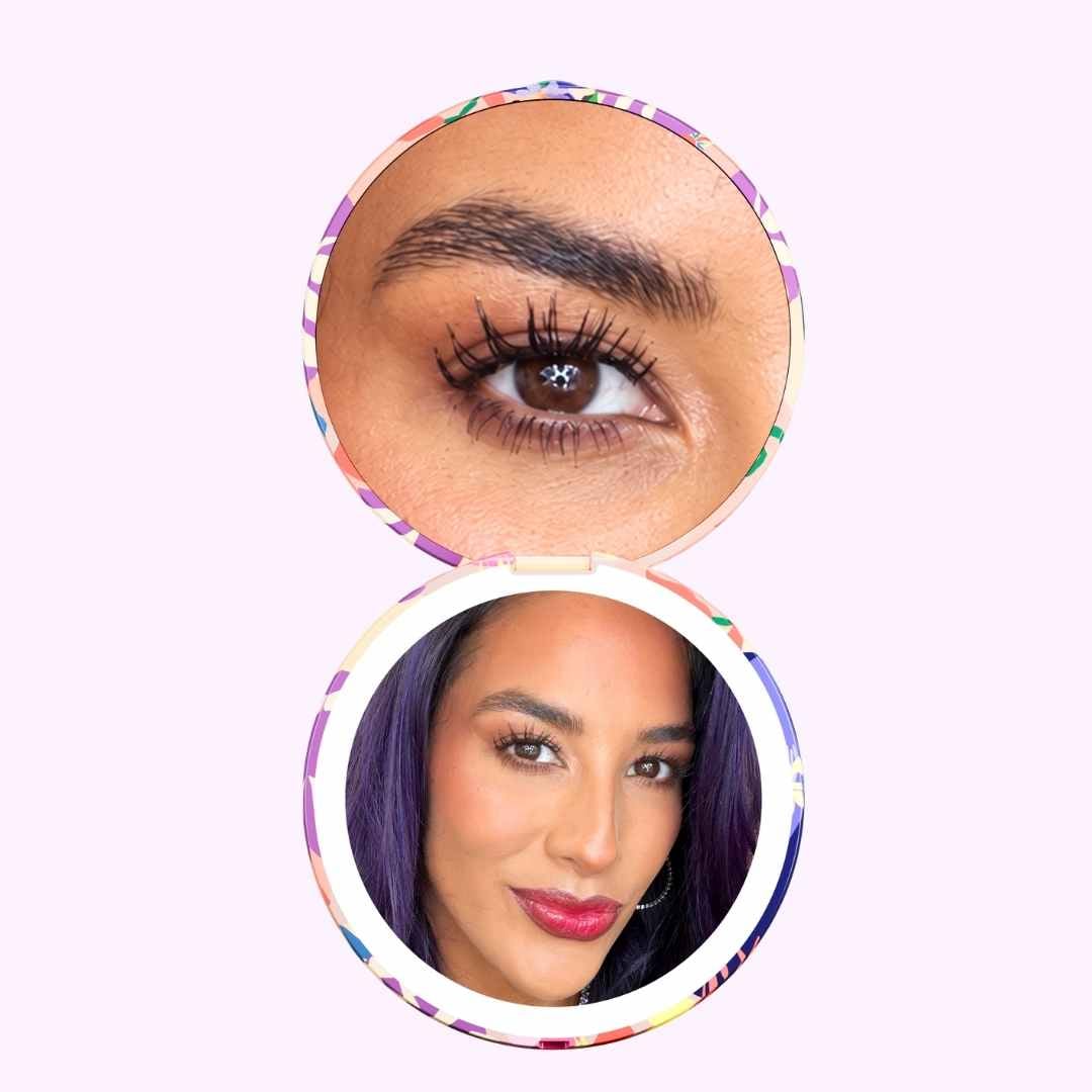 Woman looking in Vibrant Florals Mini Taylor with 10x and 1x Magnifcation