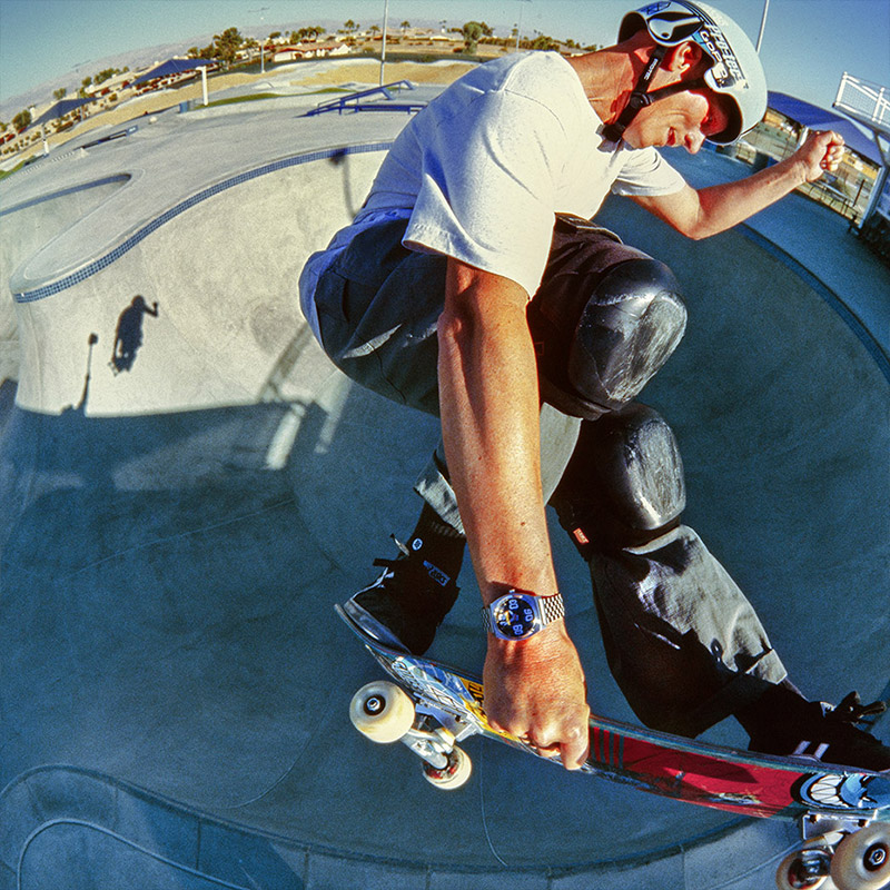 Nixon team rider Zach Miller wearing a watch from the Fisheye Collection while skateboarding.