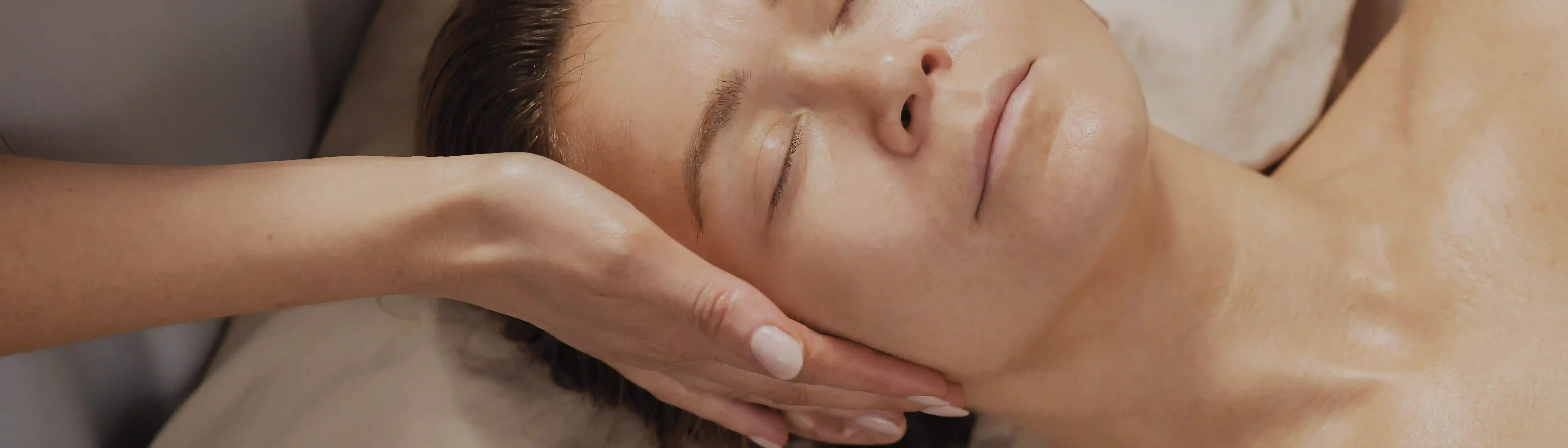 Woman receiving a professional skin treatment in salon