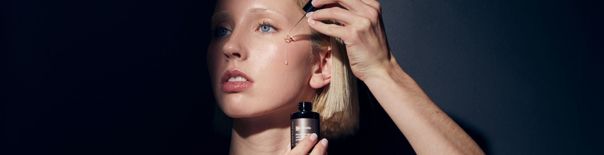 Model applying Synergie Dermiotic to skin