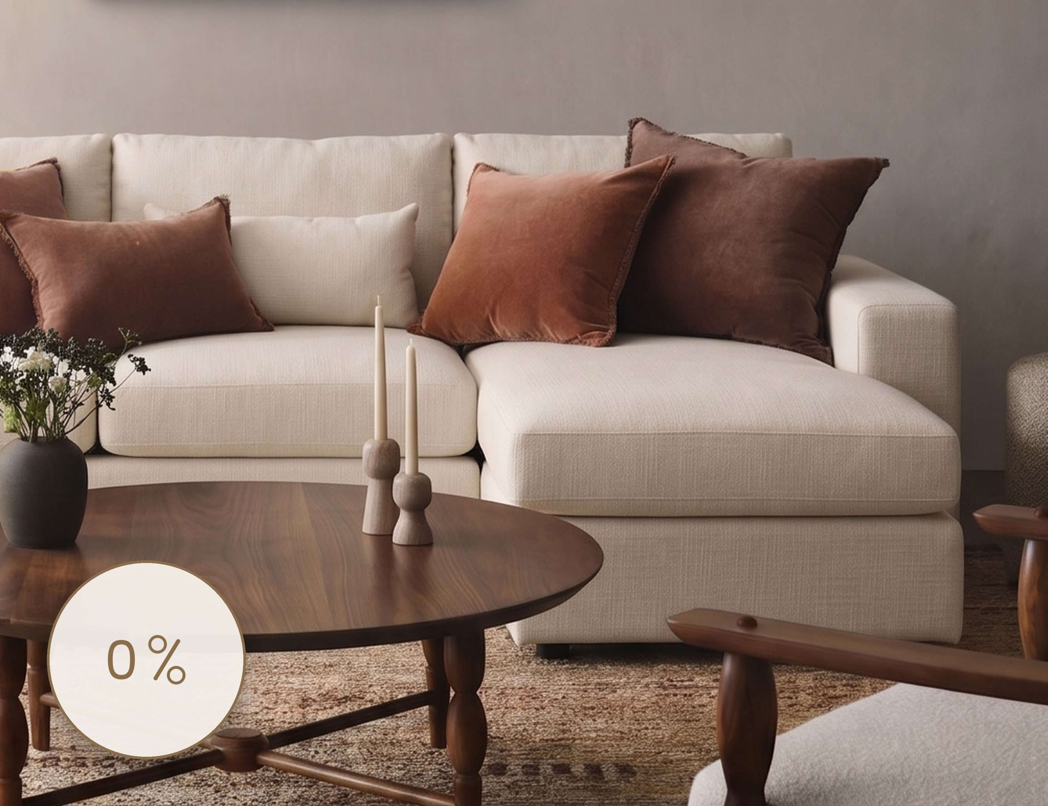Cream sofa styled with rust and terracotta pillows beside a round wood coffee table