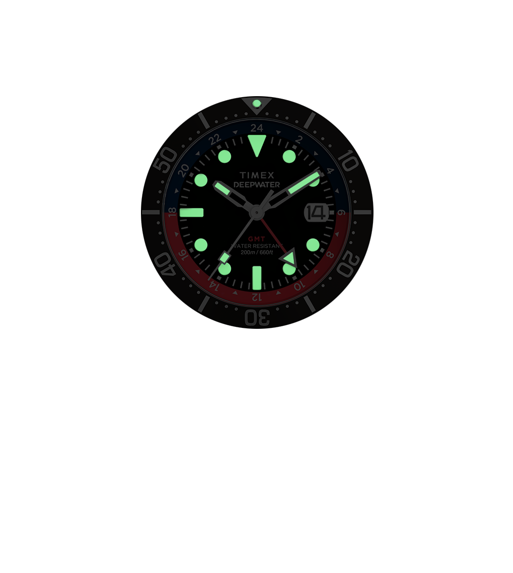 Front view of the Timex Deepwater Reef 200 GMT watch in low-light, with bright green luminous hands and markers for enhanced night or underwater visibility.