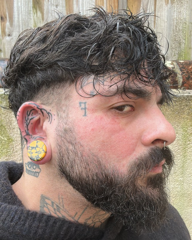 Girl wearing goth  Marble Black & Orange Stone Plug / Gauge
