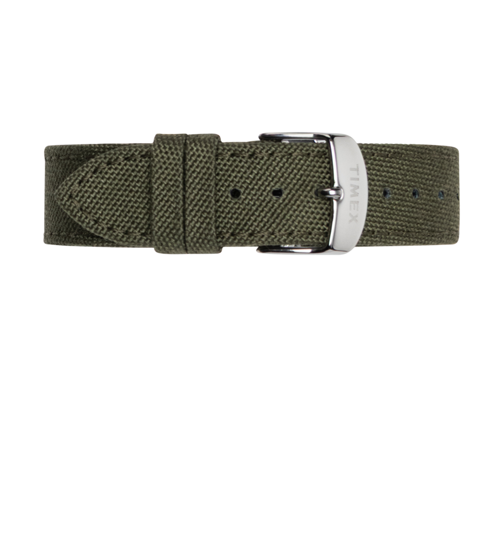 Close-up of the olive green fabric watch strap with silver-tone buckle, engraved with the Timex logo, laid flat on a white background.