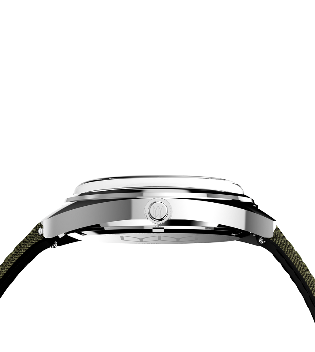 Side profile of the Timex x Bespoke Post watch showing the polished stainless steel case and crown, revealing its domed crystal and sleek cushion-shaped design.