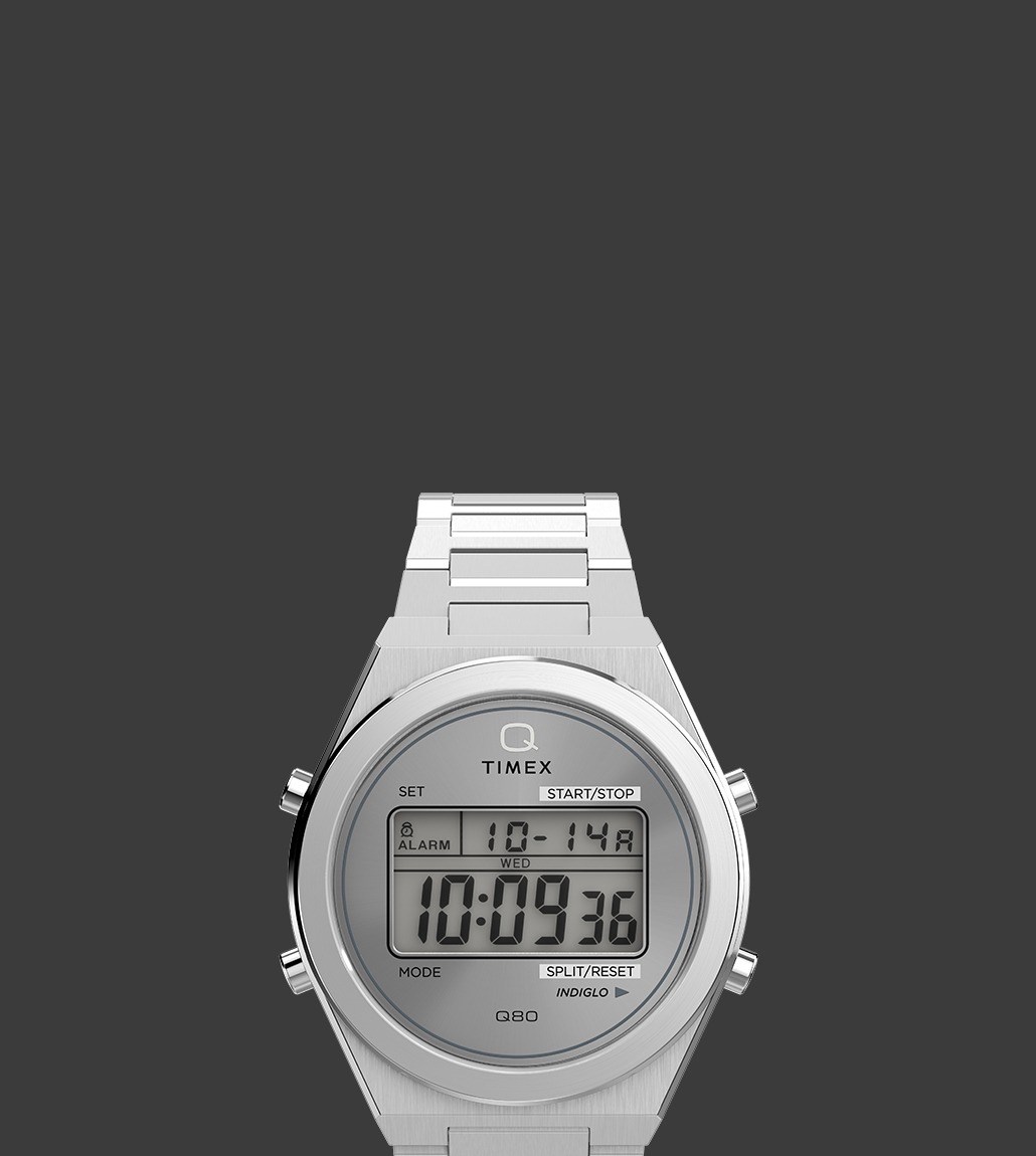 Q Timex® Q80 Continental with a clean silver-tone case and bracelet, showcasing digital features on a grey-toned display.
