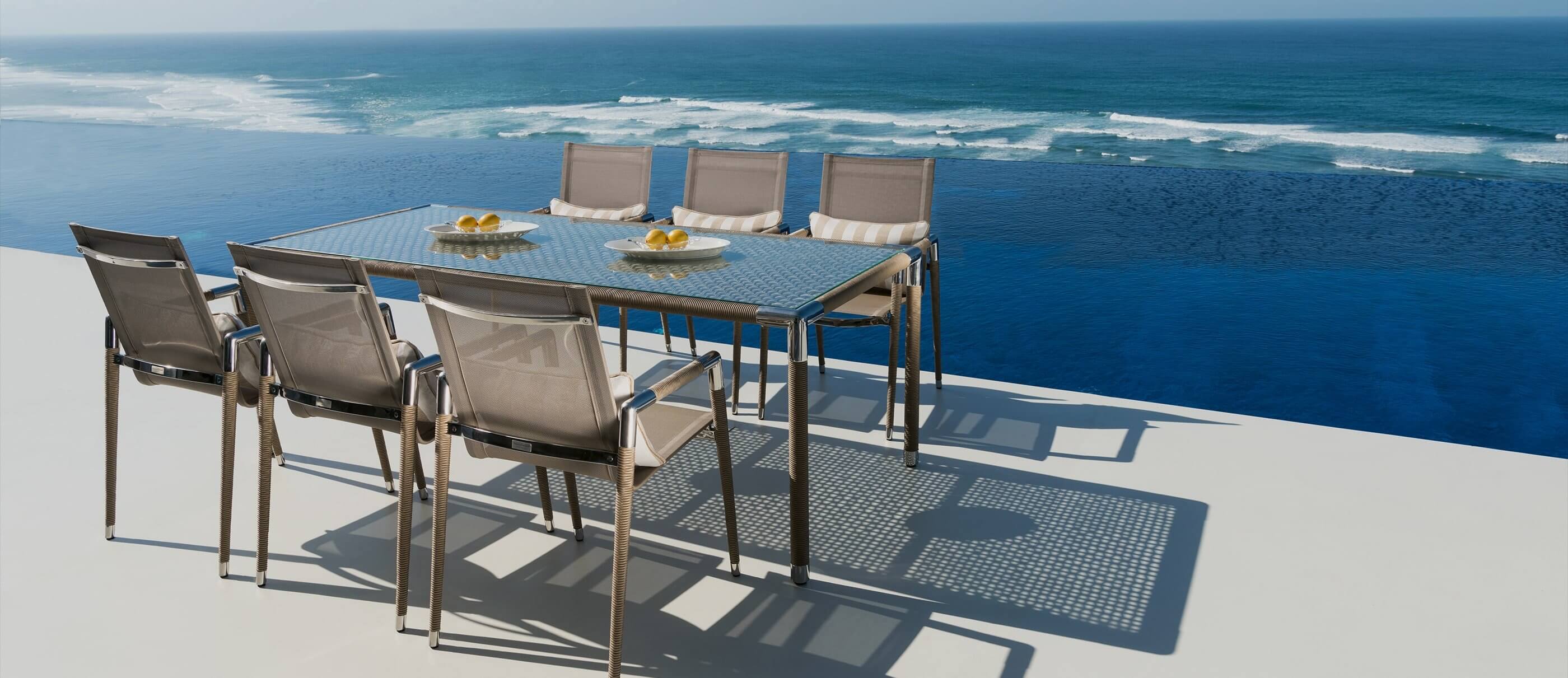 Indian Ocean furniture: luxury outdoor dining set with the ocean in the background
