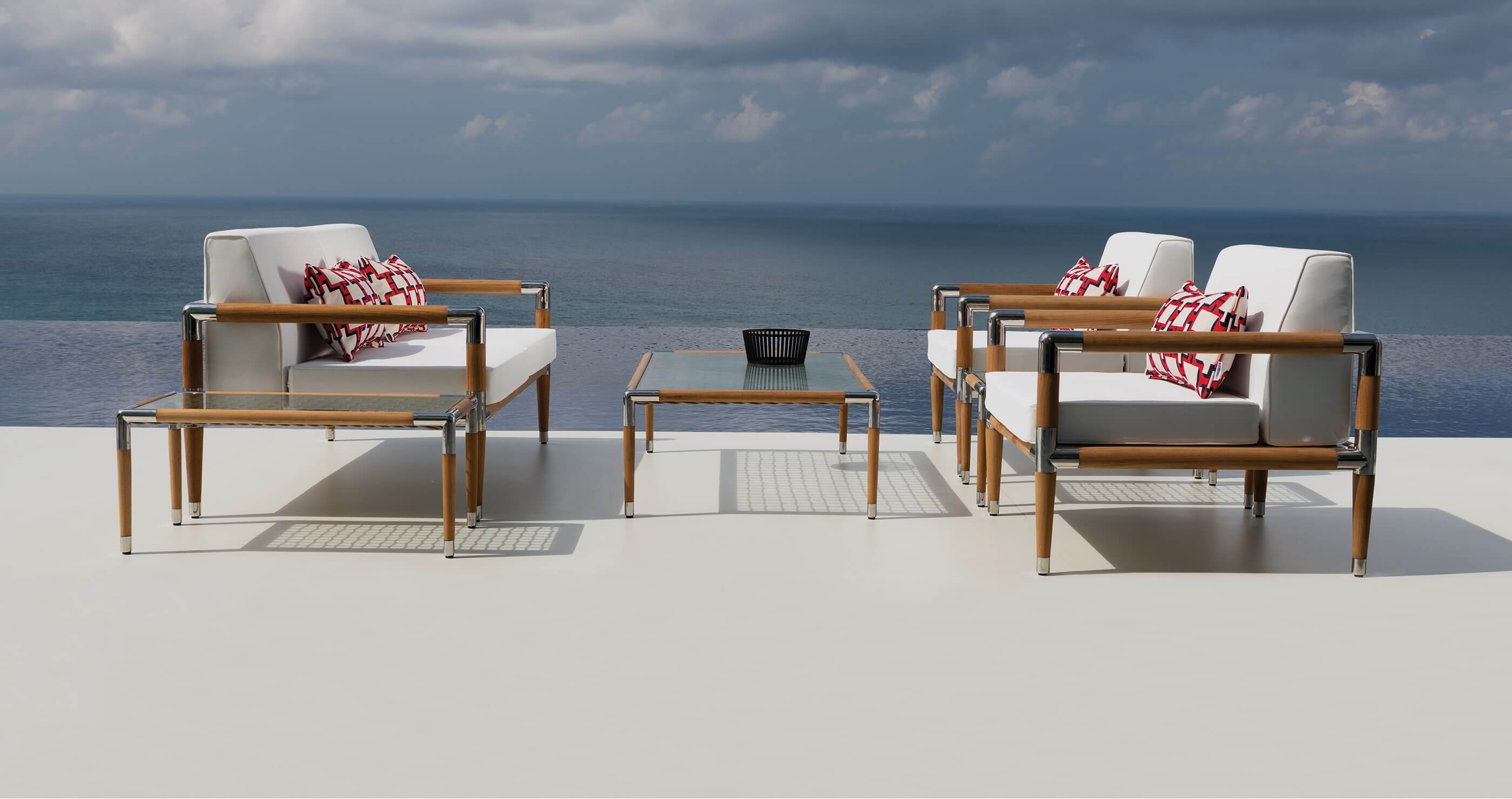 Indian Ocean furniture: luxury outdoor coffee table and chairs with the ocean in the background