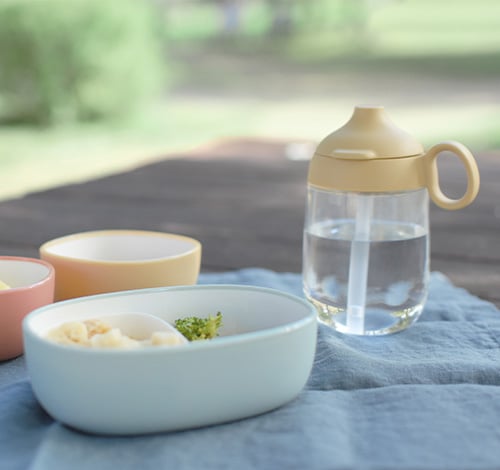  BONBO snack bowl in blue and straw mug in yellow 