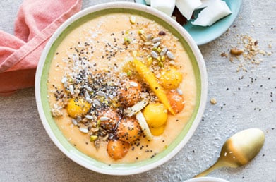 Smoothie bowl made with Navitas Turmeric Powder topped with fresh ingredients