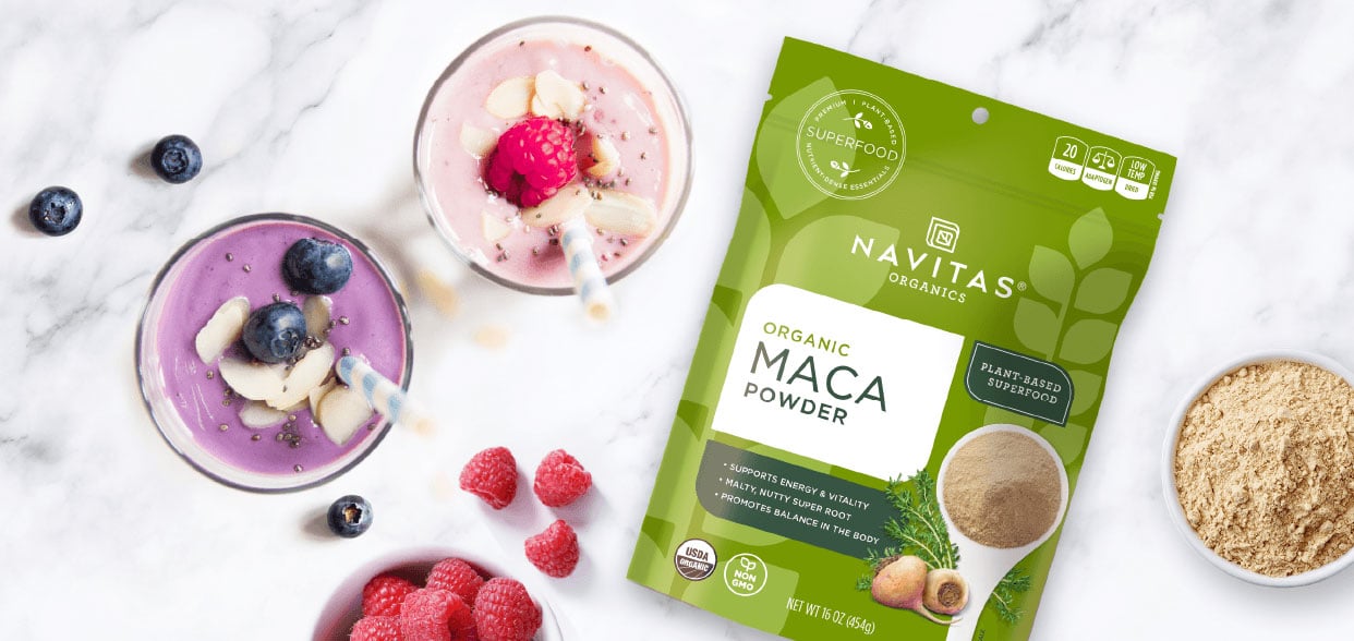 Package of Navitas Maca Powder next to smoothies made with Navitas Maca Powder