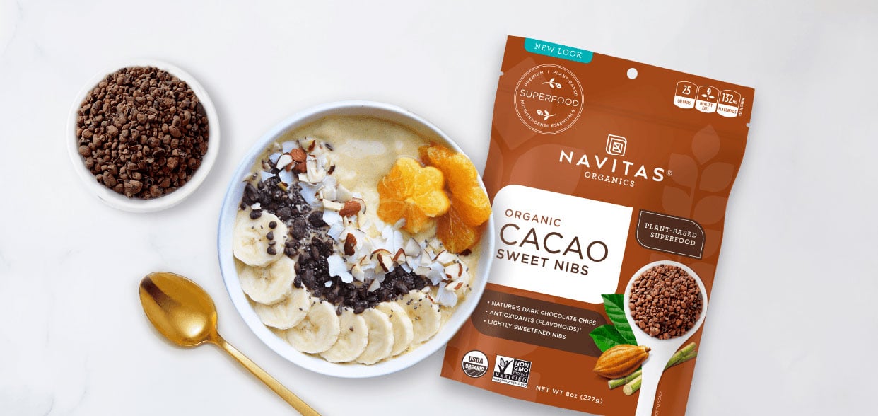 Yogurt bowl made with Navitas Cacao Sweet Nibs and fresh fruit and ingredients