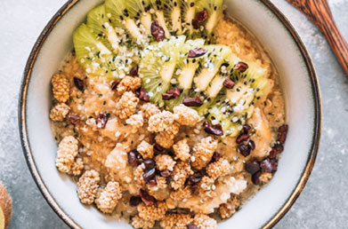 Bowl of oatmeal made with Navitas Mulberries topped with fresh ingredients
