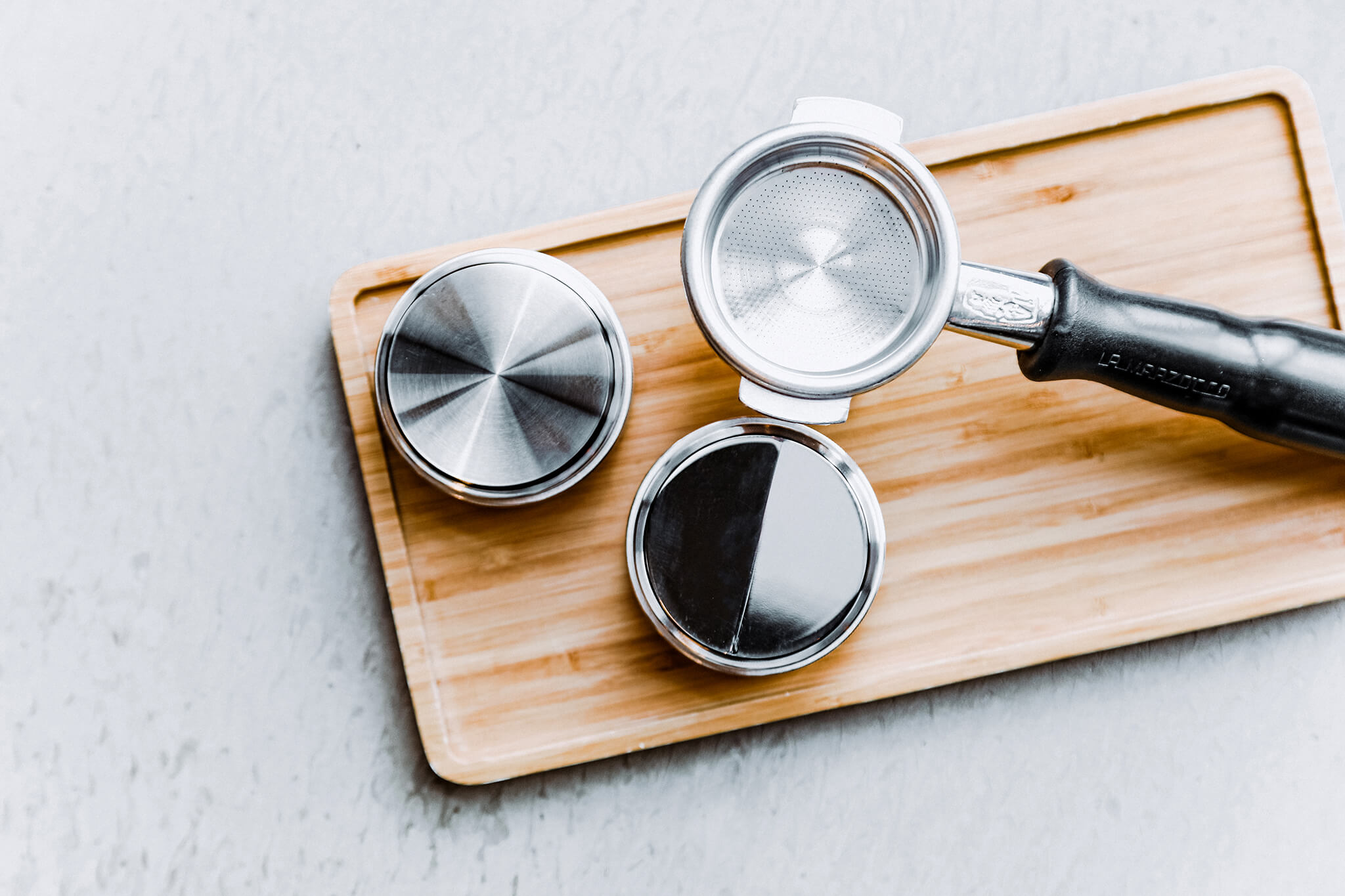 A set of coffee tampers sitting on the table