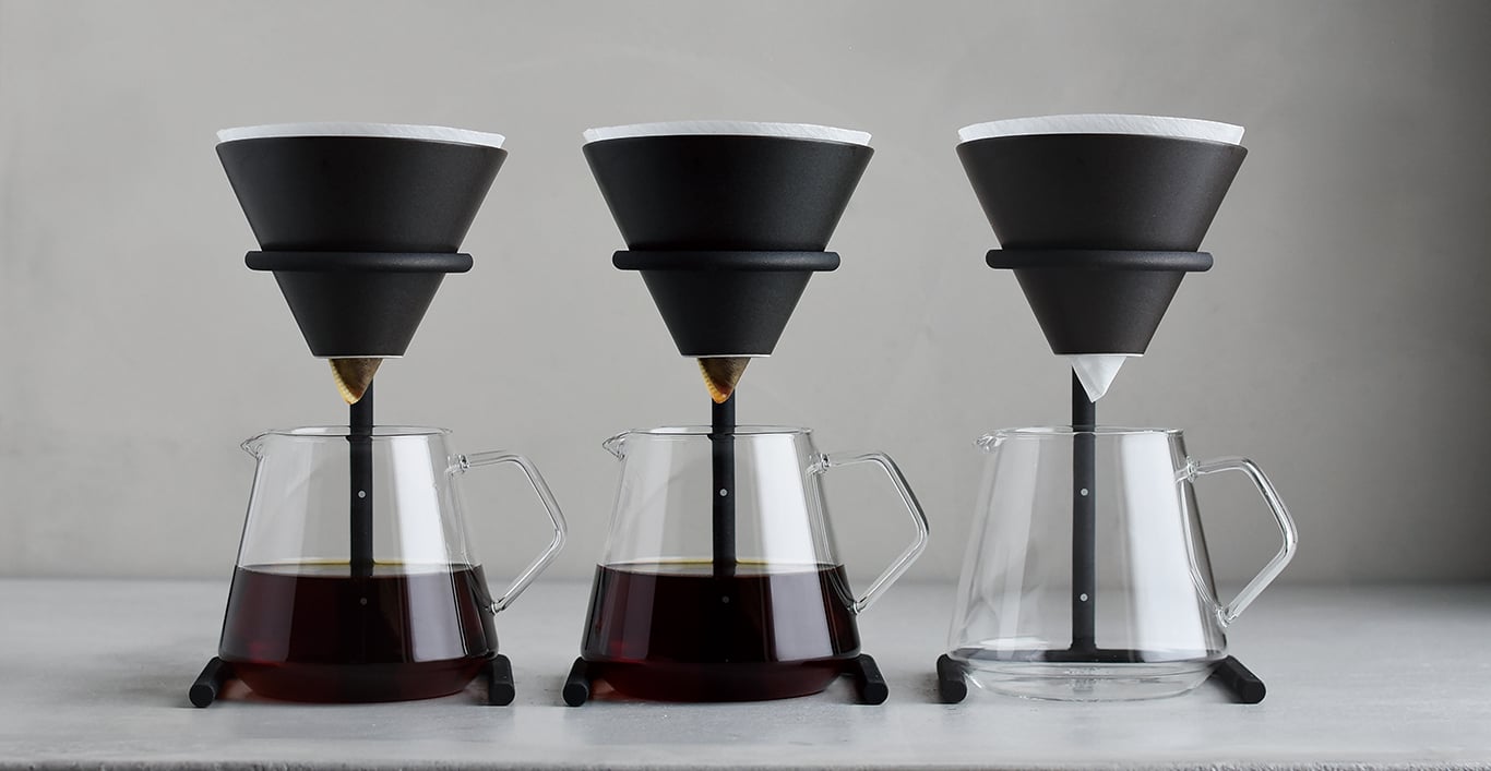  Three SCS-S04 brewer stands with two filled with coffee and one empty  