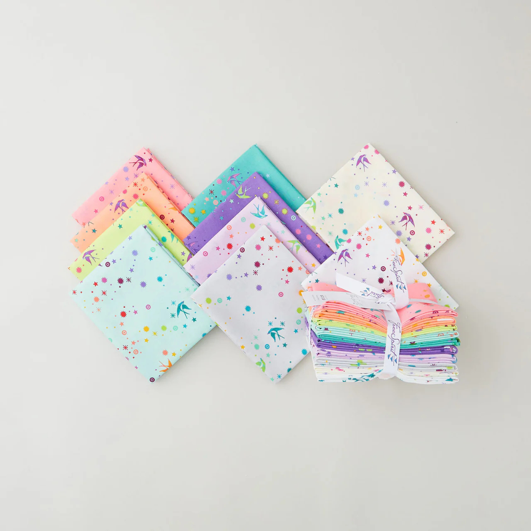 a selection of fat quarter fabrics from the Tula Pink True Colors fabric collection.