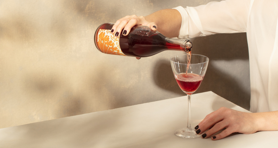 Hand pouring wine