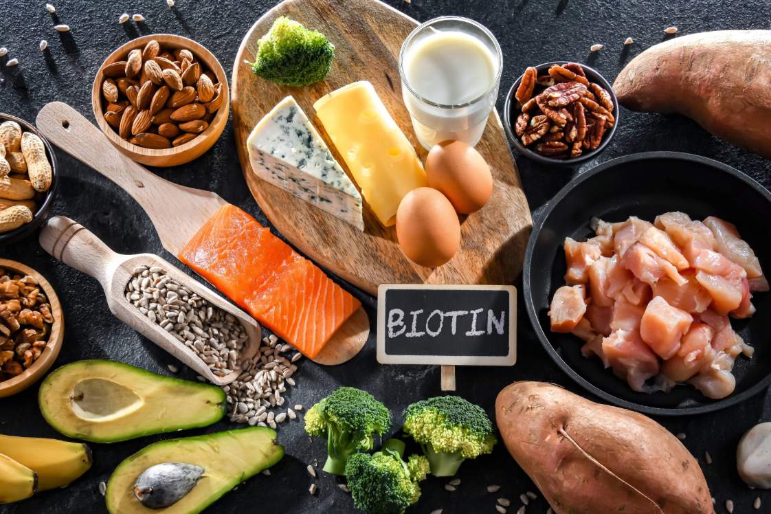 Foods containing biotin including eggs, salmon, nuts, and vegetables
