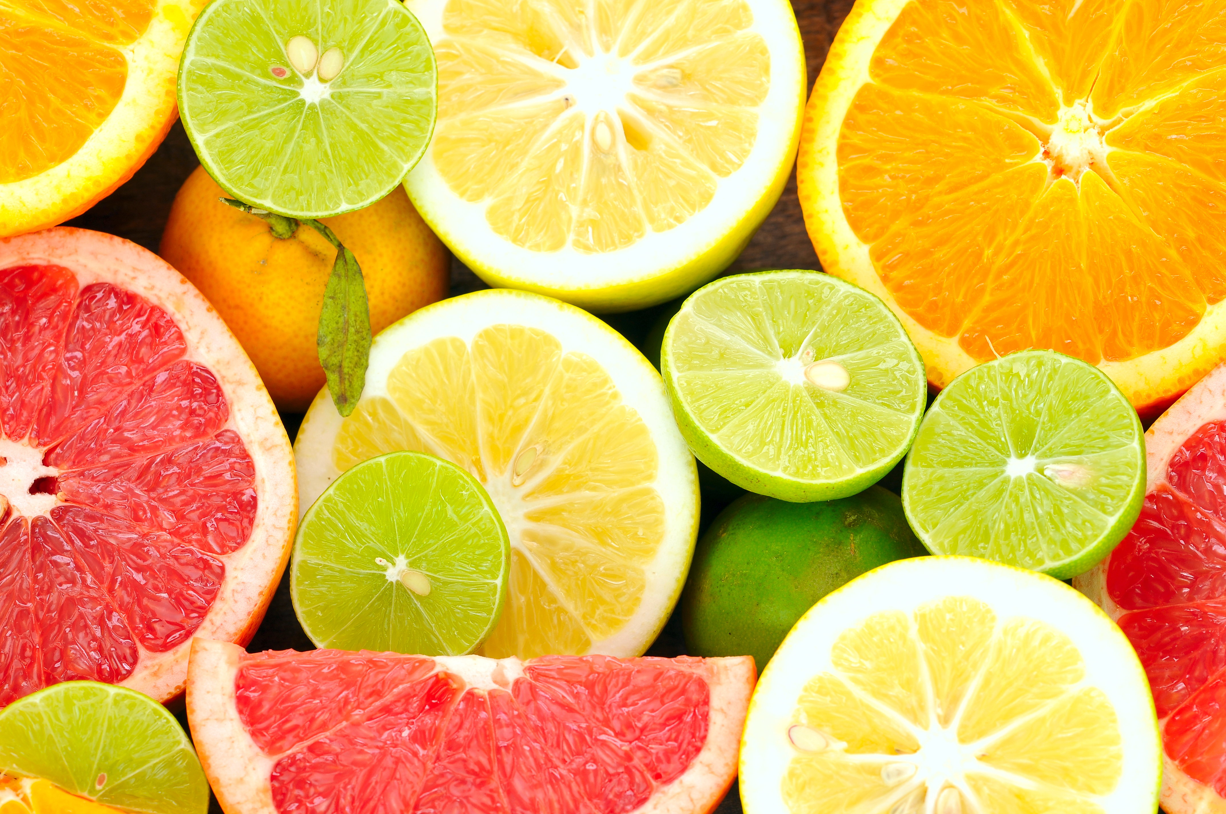 Assorted citrus fruits including oranges, grapefruits, and limes.