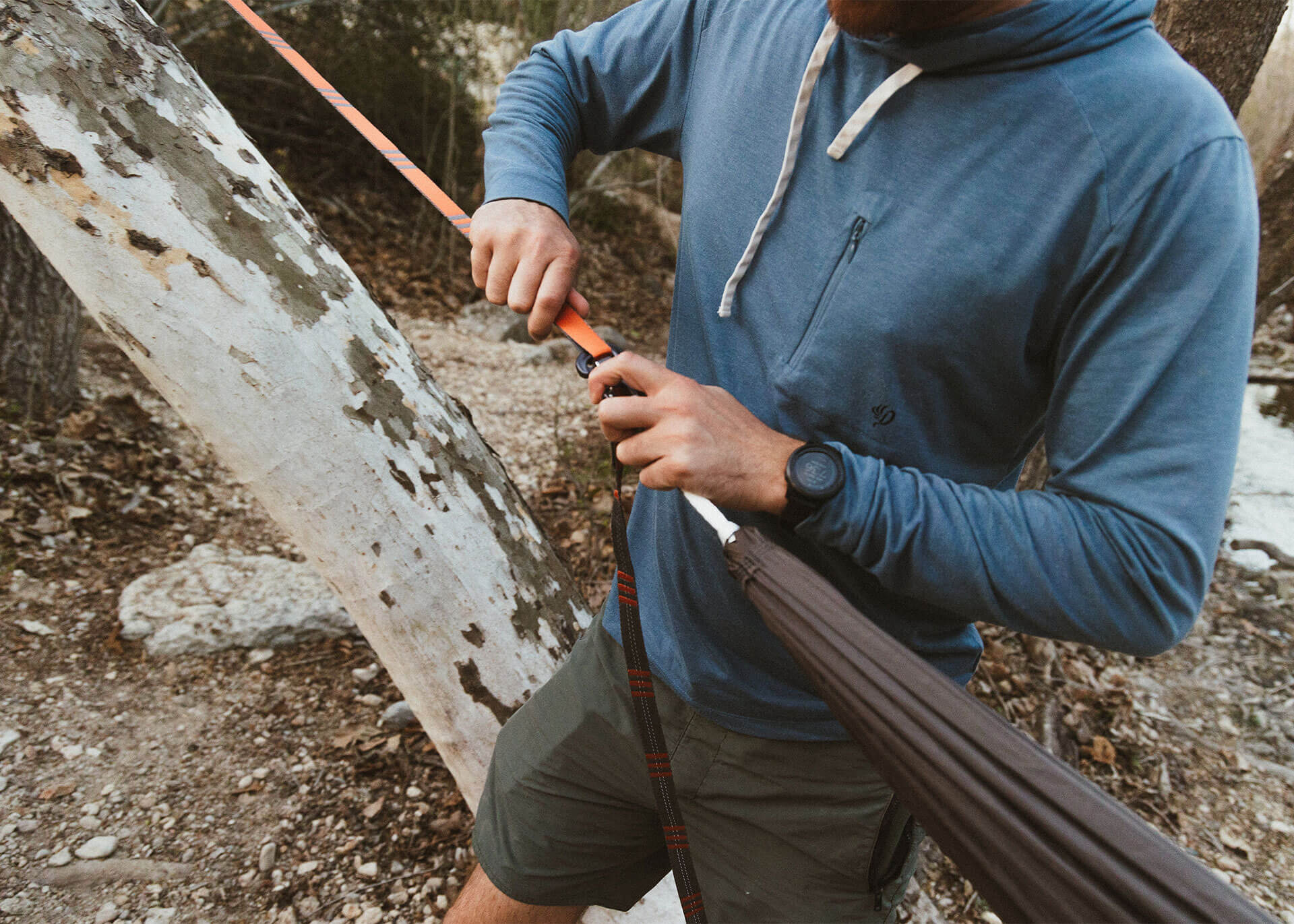 Man setting up Roo Double XL with Python 10 straps.