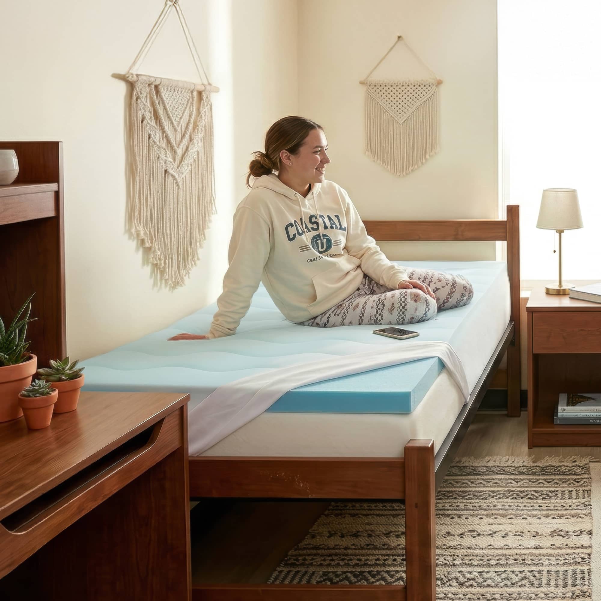 Orders placed by 2pm ships sam day. Responsive support.  Photo of a light blue mattress topper with a white lightly padded cover on top of a bed.