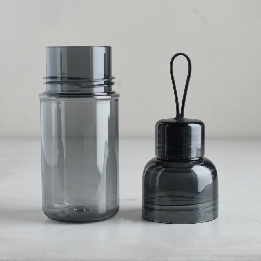  WORKOUT bottle smoke with lid off and placed next to the bottle  