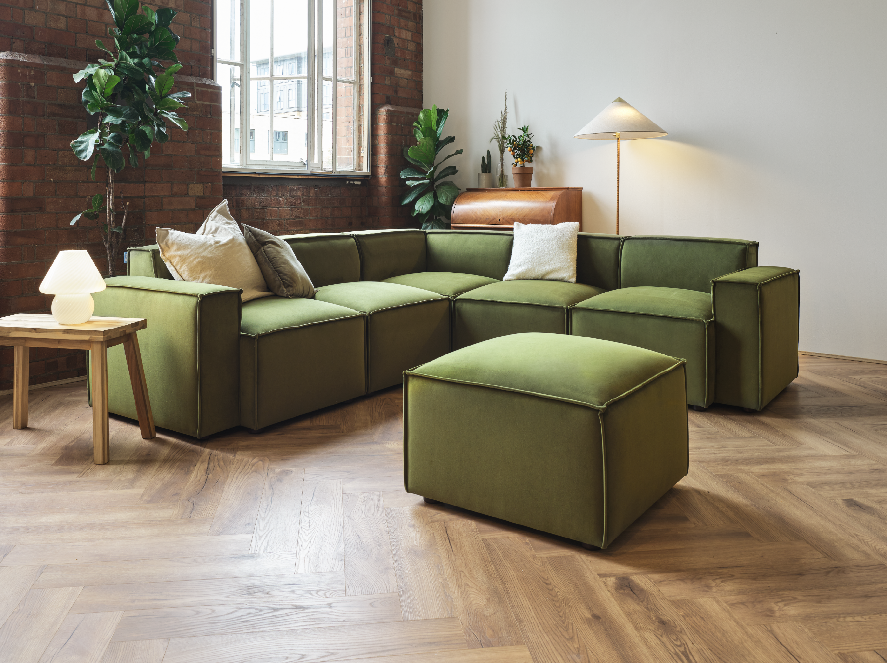 Green corner sofa with ottoman