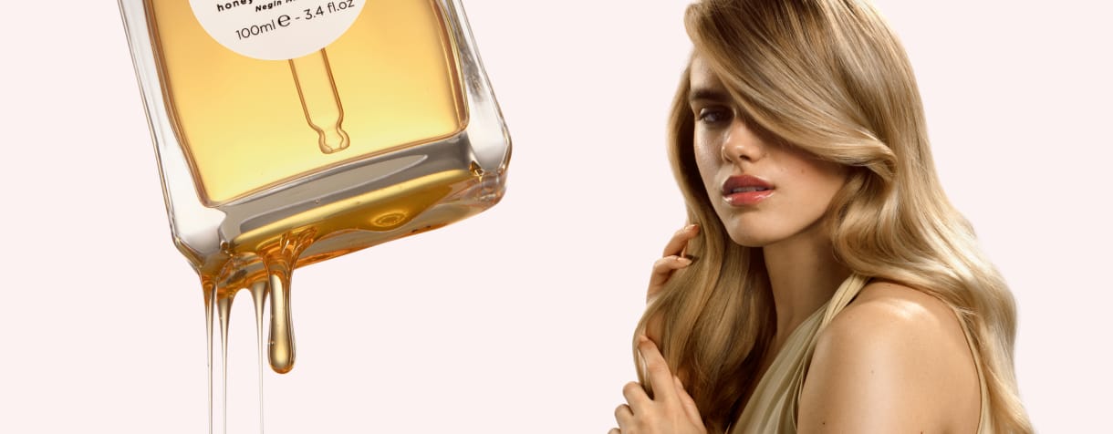 Honey Infused Hair Oil floating in air
