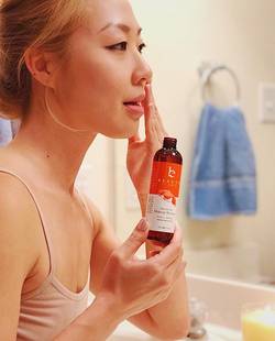 Woman using Beauty By Earth's Makeup Remover