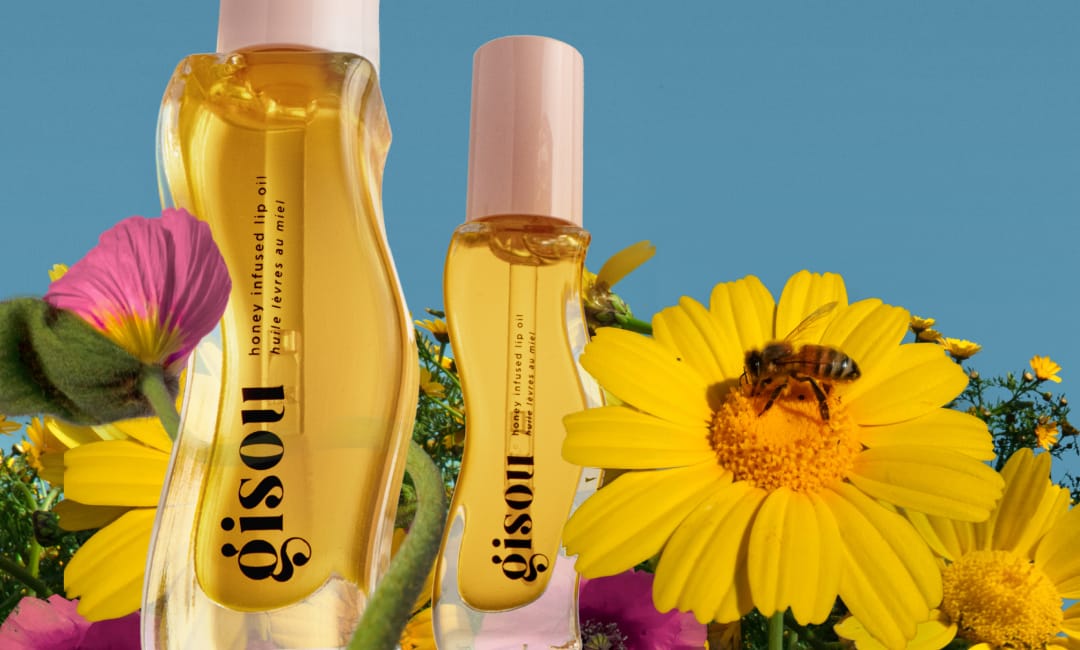 Honey Infused Lip Oil in a field of daisies