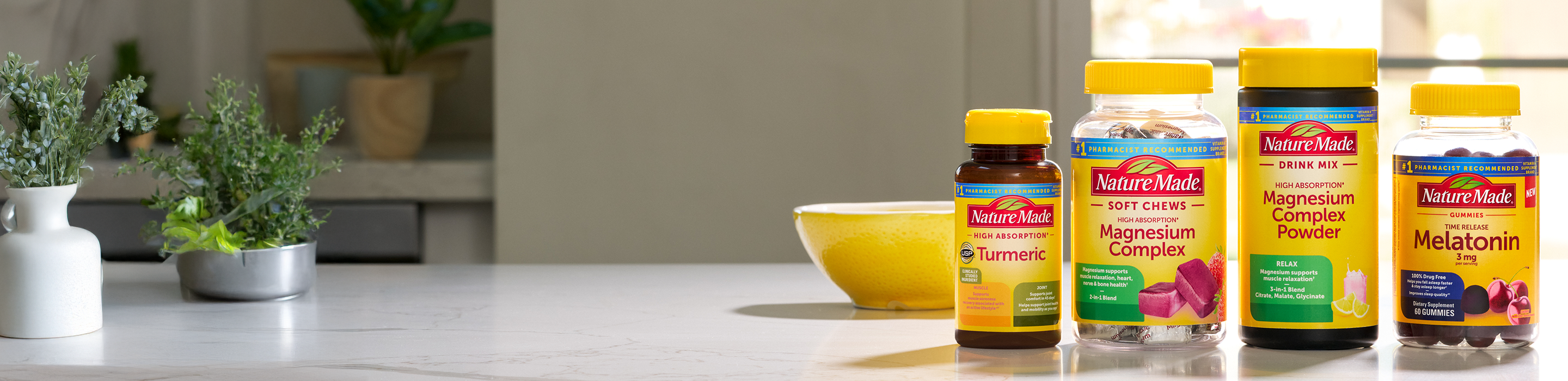 Nature Made Advanced Multi, Berberine Phytosome, Zero Sugar C Gummies, and Choline on a counter