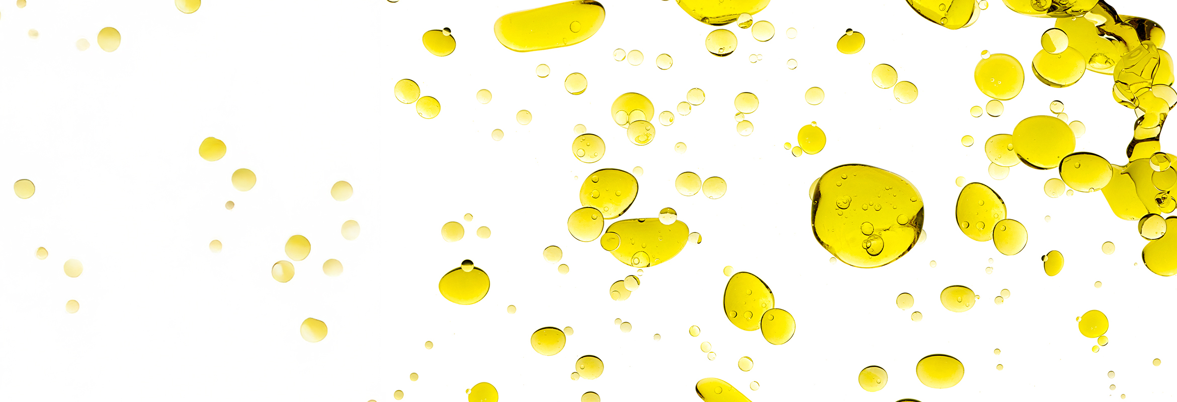 Vitamin E oil droplets on a light background
