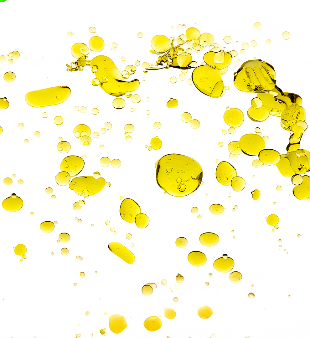 Vitamin E oil droplets on a light background