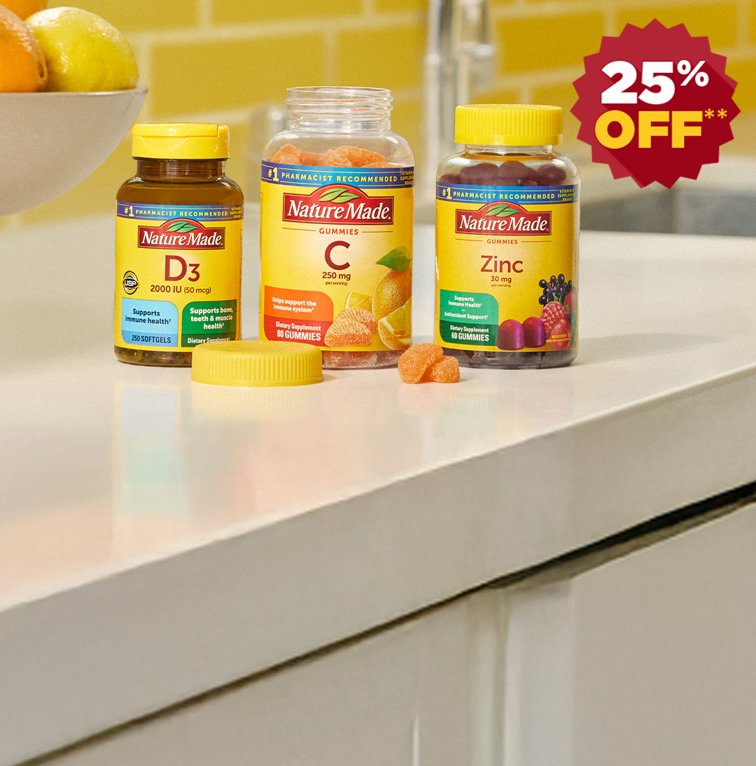 Nature Made Vitamin D3, Vitamin C and Zinc supplements on a kitchen counter top with a bright yellow tile background with a 25% off red burst.