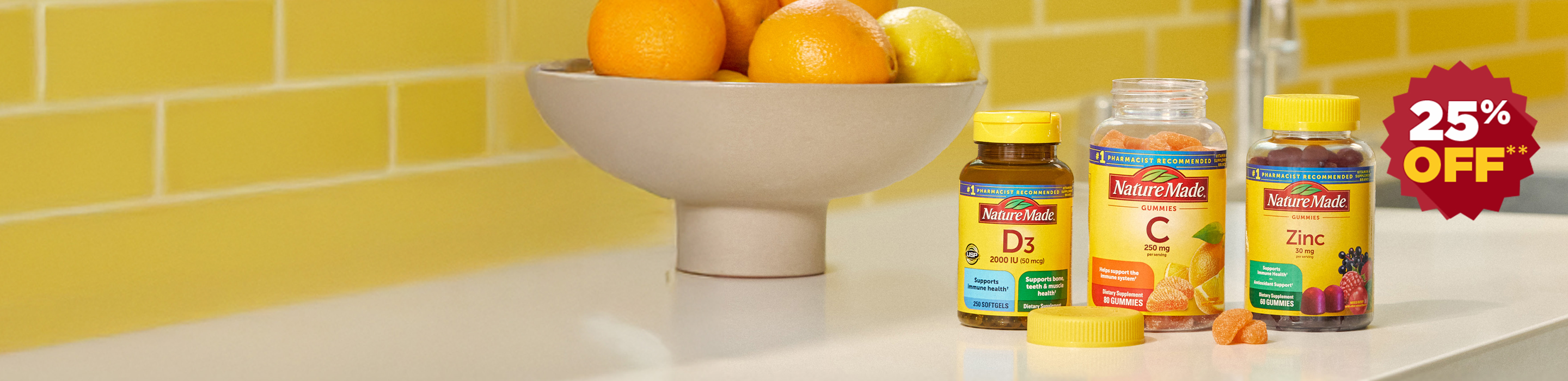 Nature Made Vitamin D3, Vitamin C and Zinc supplements on a kitchen counter top with a bright yellow tile background with a 25% off red burst.