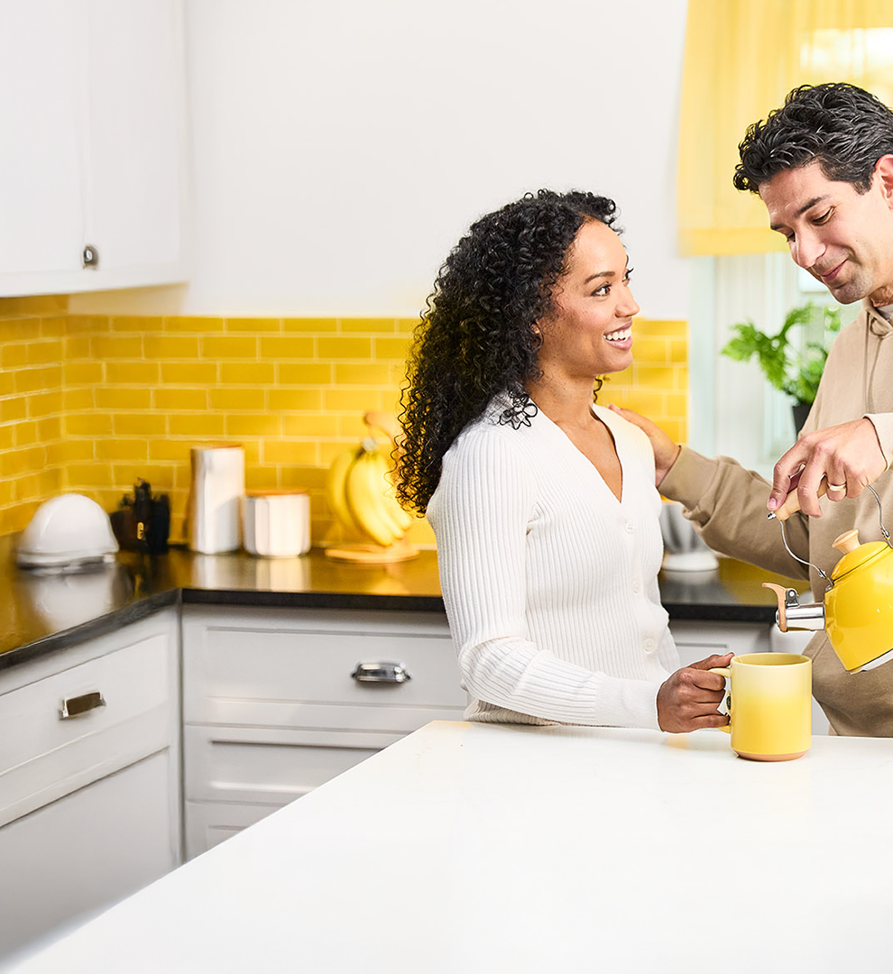 Couple smiling in a kitchen