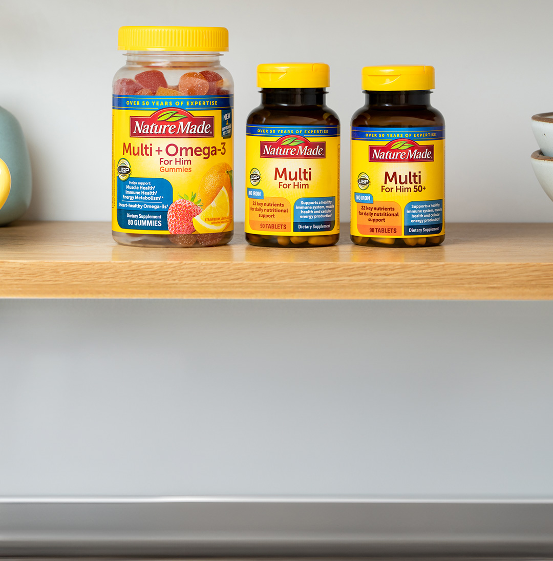 Nature Made® Multi + Omega-3 For Him, Multi For Him, and Multi For Him 50+ Supplements sitting on a table