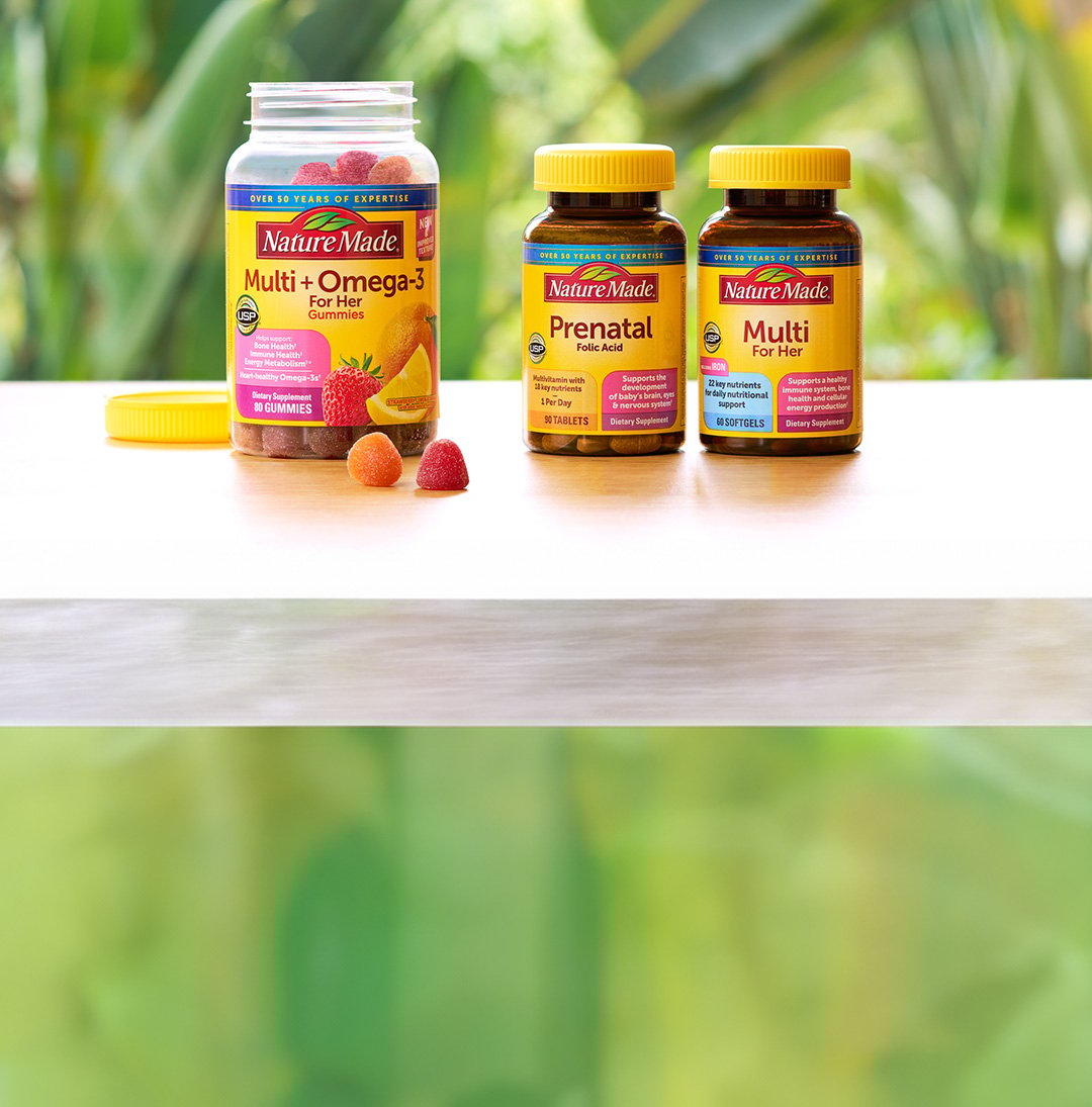 Nature Made® Multi + Omega-3 For Her, Prenatal Folic Acid, and Multi for Her Supplements sitting on a table