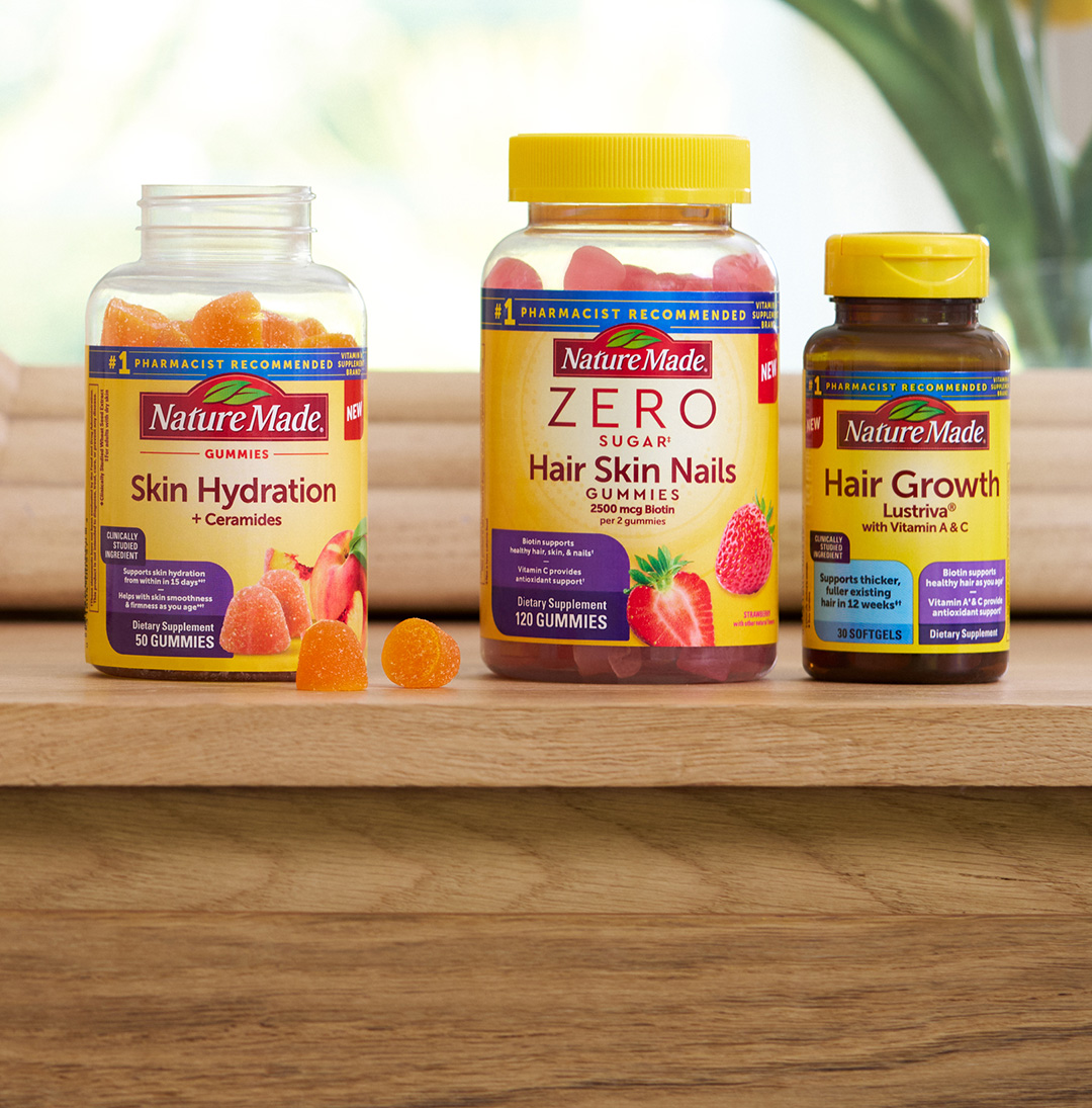 Three Nature Made supplement bottles: Skin Hydration Gummies, Zero Sugar Hair Skin Nails Gummies, and Hair Growth Softgels.