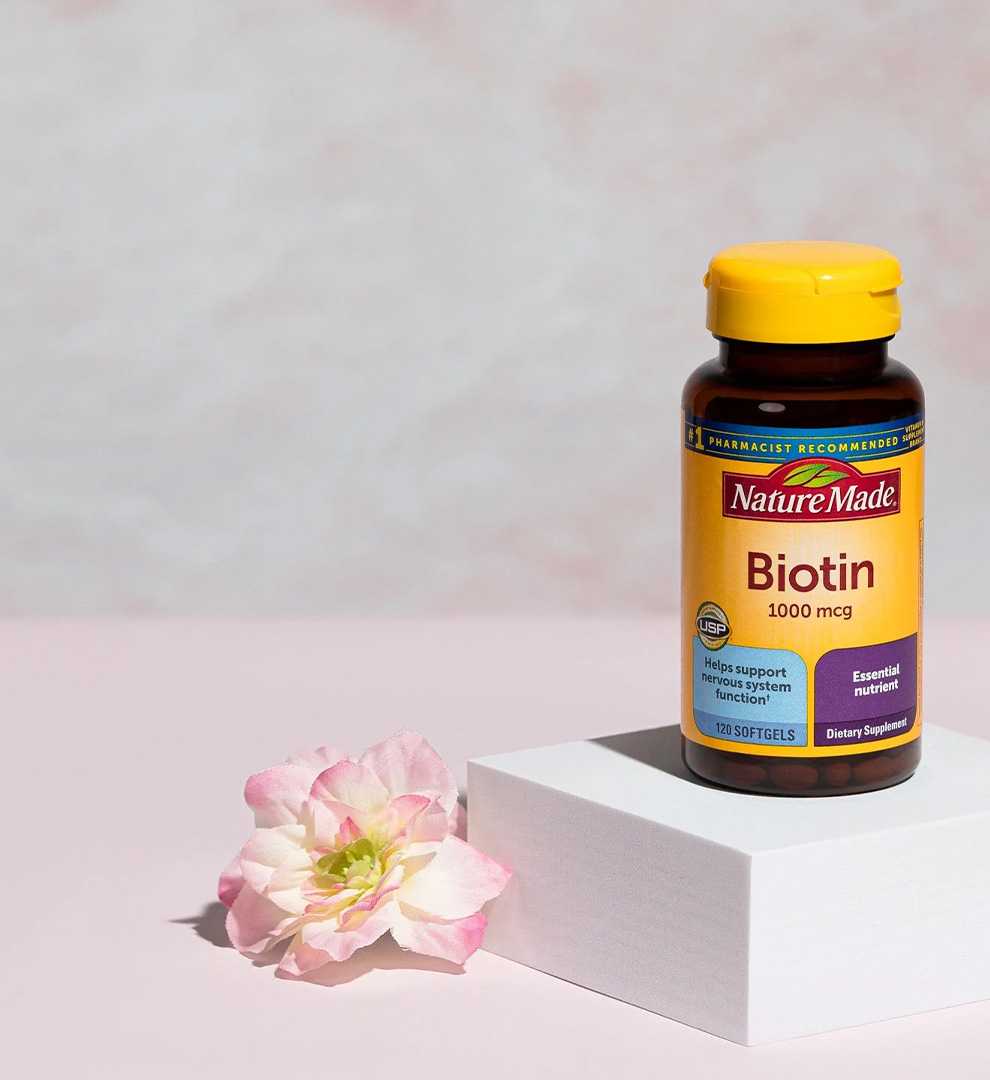 Nature Made Biotin 1000 mcg softgels with a flower