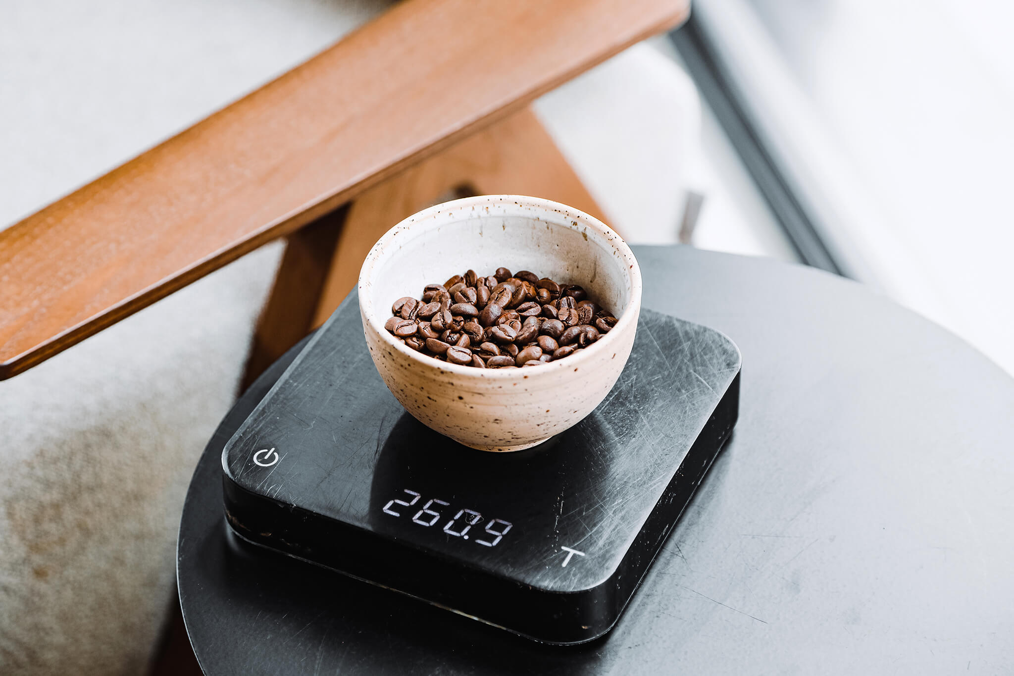 A set of coffee scales being used