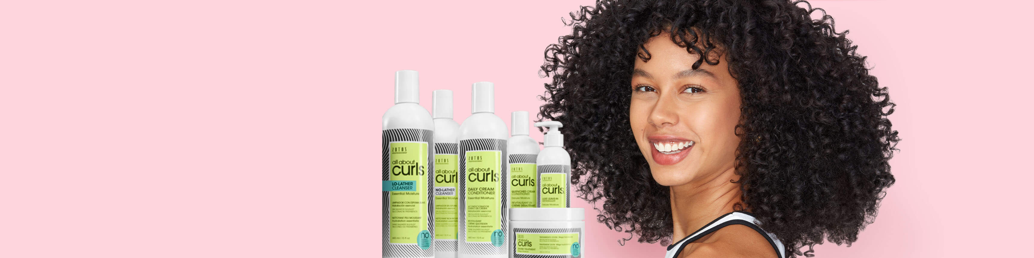 Curly hair model with products on pink background