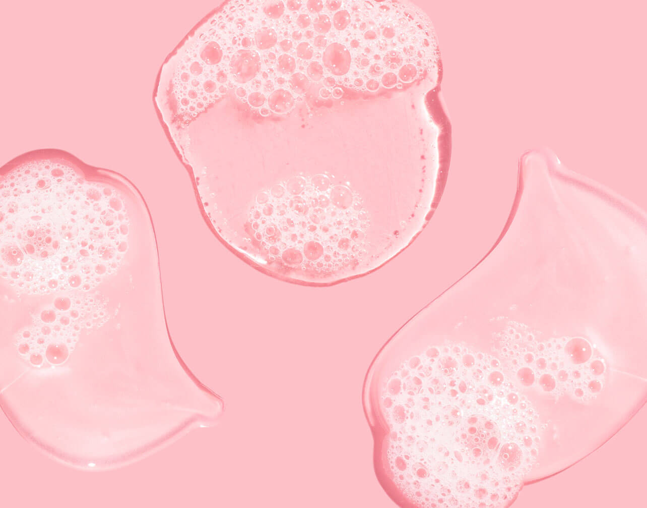 hair gel with bubbles on pink background