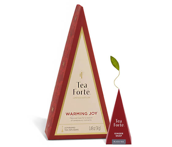 Warming Joy Petite Tea Tree of 4 teas,closed, with pyramid tea infuser next to it.