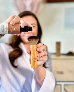 Woman holding Beauty By Earth Tanning Serum