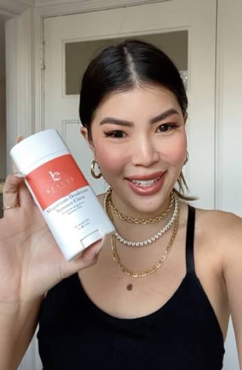 Woman using Beauty By Earth's Magnesium Deodorant