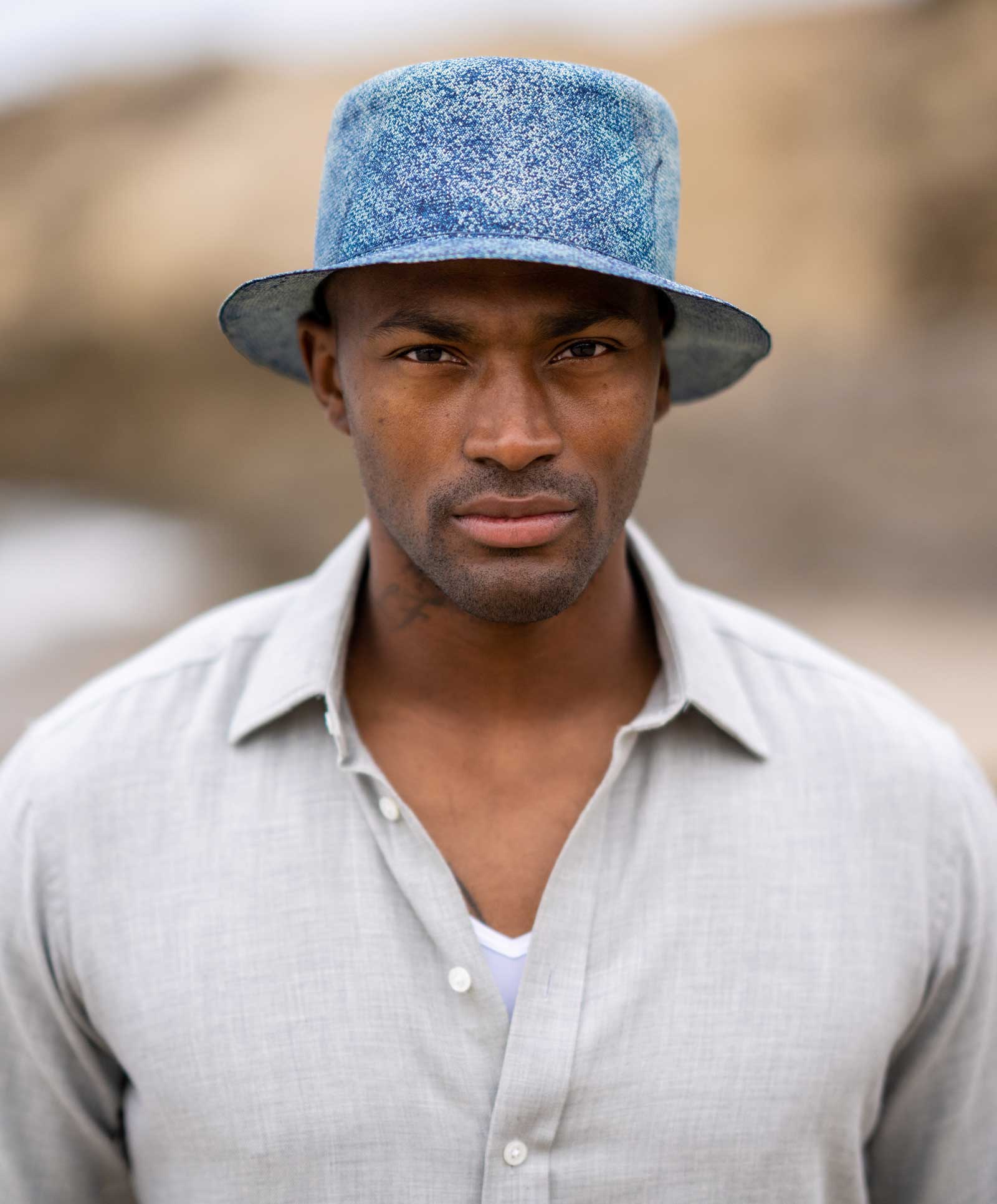 Design
Rarer than a perfect diamond and infinitely more refined, we are proud to carry the most exquisitely crafted Montecristi Panama straw hats in the world. This Montecristi Bucket Hat is hand-dyed with a unique Indigo Washed color.
Material
Exquisitely handwoven Montecristi straw, hand-dyed. All our hats are exquisitely handmade, therefore they are unique and not identical. Please allow a variation in the color combination.
Specifications
3 1/2 semi-flat crown and 1 3/4 to 2 brim. This Montecristi Bucket Hat is hand-dyed with a unique Indigo Washed color.Please allow 3-6 weeks to custom make this special piece.